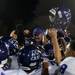 The Pioneer football team lifts coach Tom Barbieri in celebration after defeating Dexter High School 69-0 on Friday. Barbieri was head coach of Dexter football for 10 years. Daniel Brenner I AnnArbor.com